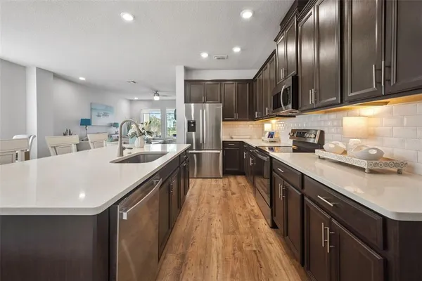 a kitchen with a sink and cabinets