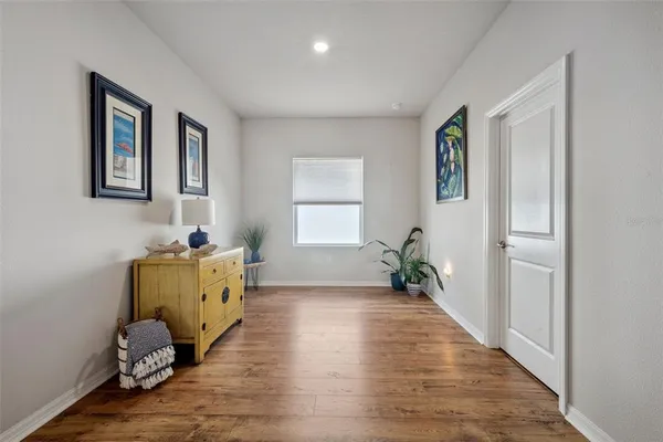 a view of living room with furniture and floor to ceiling window