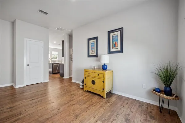 a garden with trees in front of it