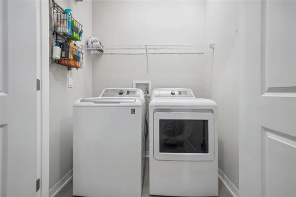 a view of a lake with a houses in the background