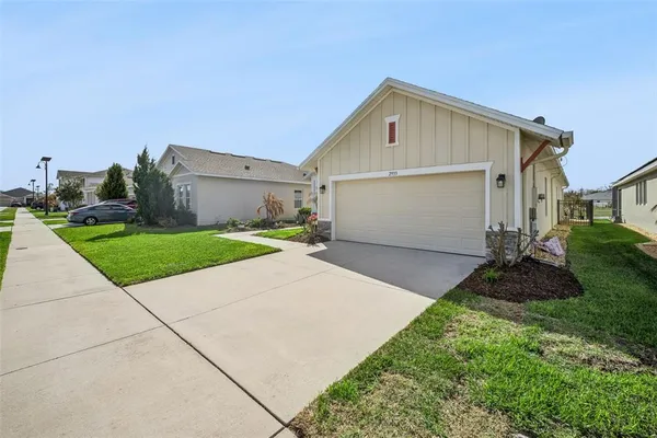 a front view of house with yard and entertaining space