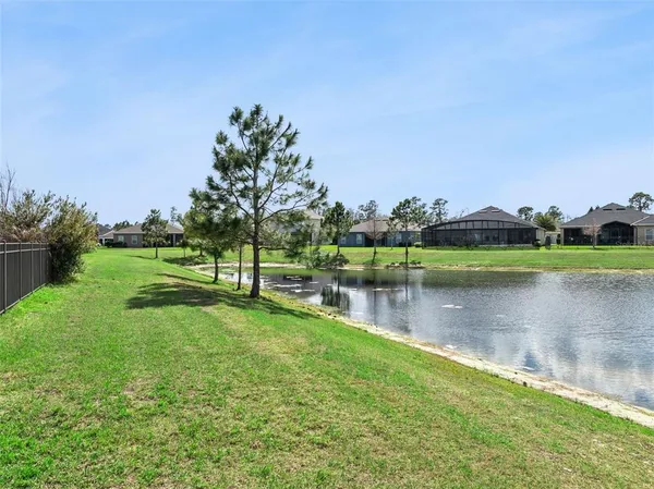 a living room with lots of furniture and wooden floor