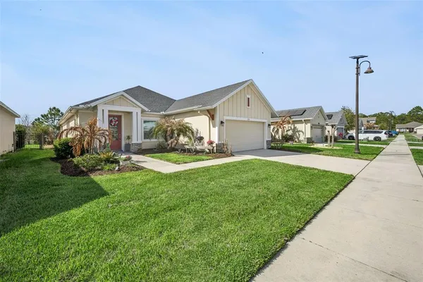 a front view of a house with yard