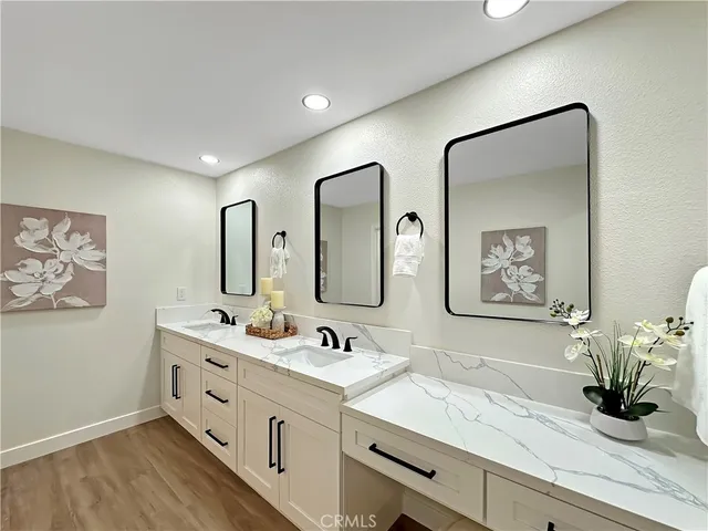 a bathroom with a double vanity sink and a mirror
