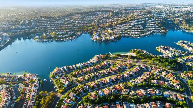 an aerial view of a houses with ocean view