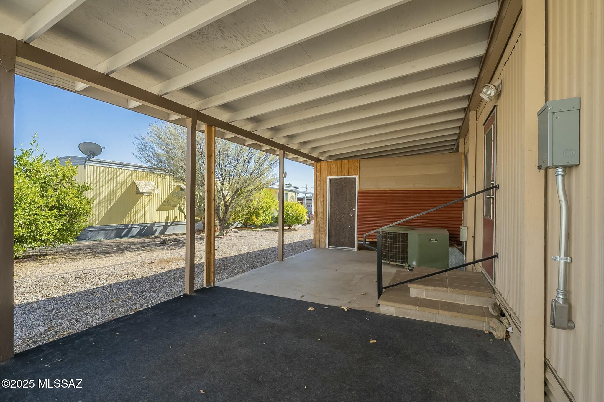 5850 West Box R Street Tucson, AZ 85713 - Photo 26 of 29 There is a second back patio just outside the kitchen ideal for barbecuing in the shade.