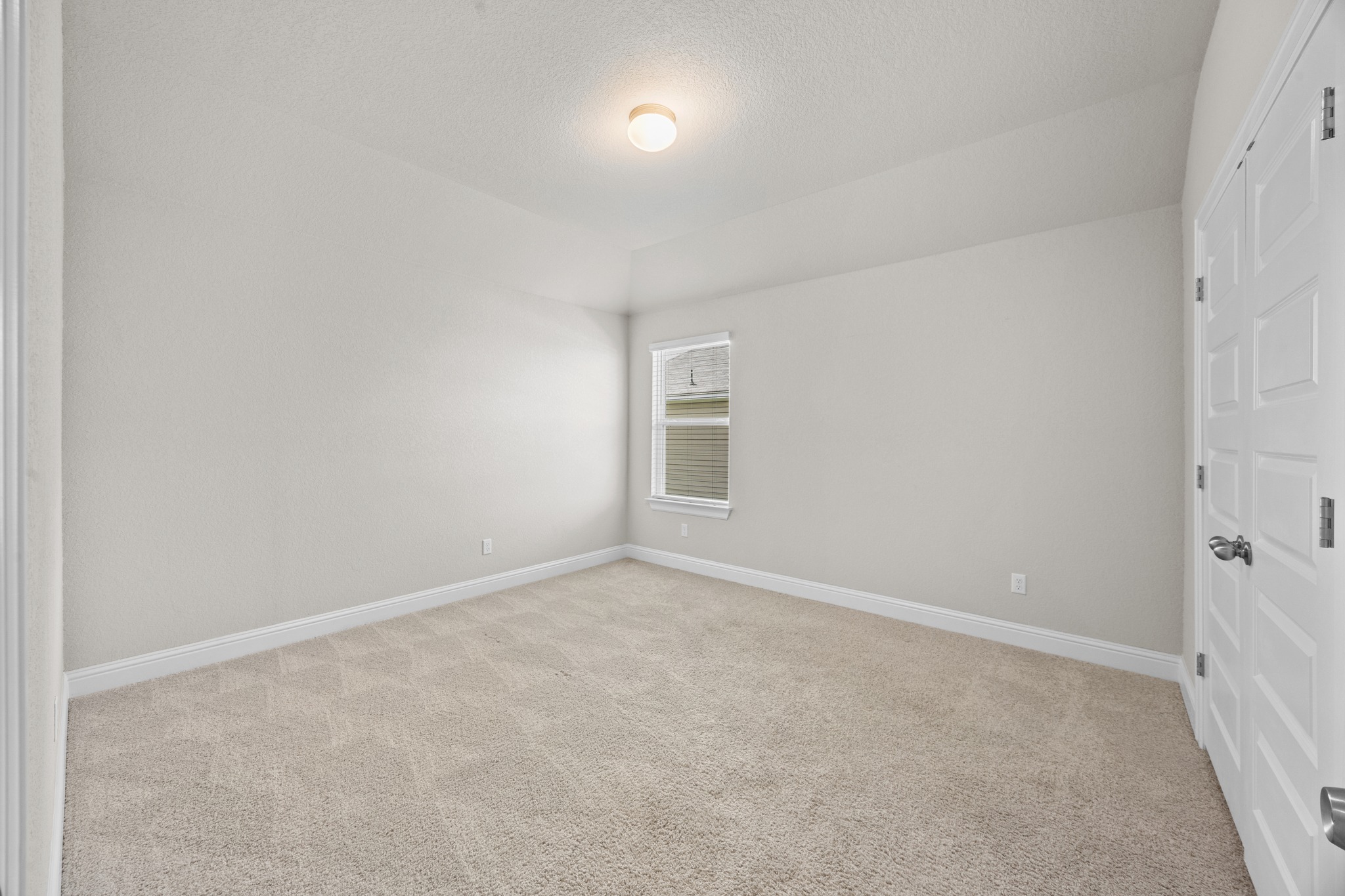 213 Graver Street Georgetown, TX 78626 - Photo 27 of 33 A well-proportioned bedroom with a window offering ample daylight and comfortable carpeted flooring.