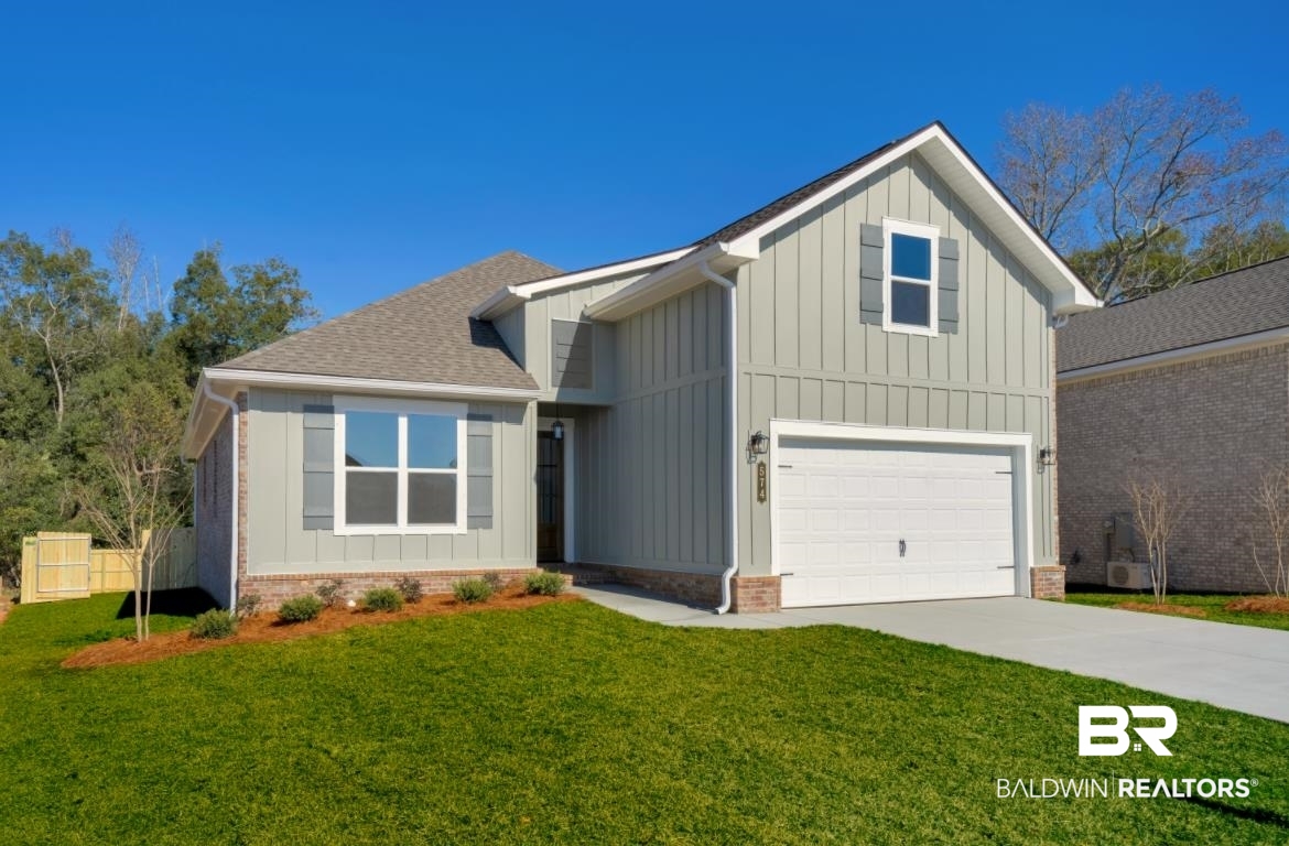 574 Morning Mist Way Fairhope, AL 36532 - Photo 1 of 59 Modern farmhouse style home featuring board and batten siding, driveway, an attached garage, and roof with shingles