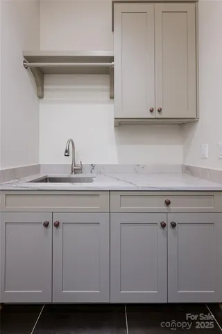 a view of a hallway with windows and stairs