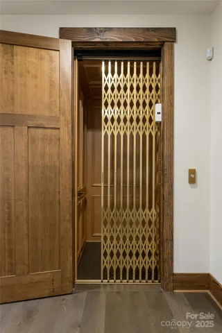 a view of porch with furniture and floor to ceiling window