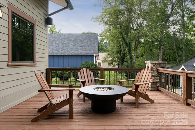 a view of a patio with a table chairs and backyard