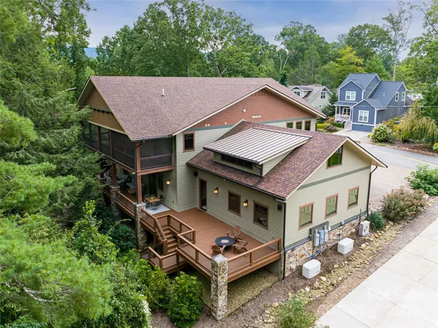 an aerial view of a house with a mountain view