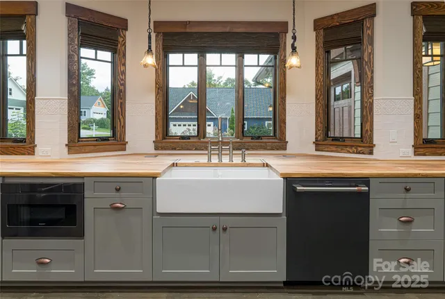 a sink with granite countertop a sink and a window