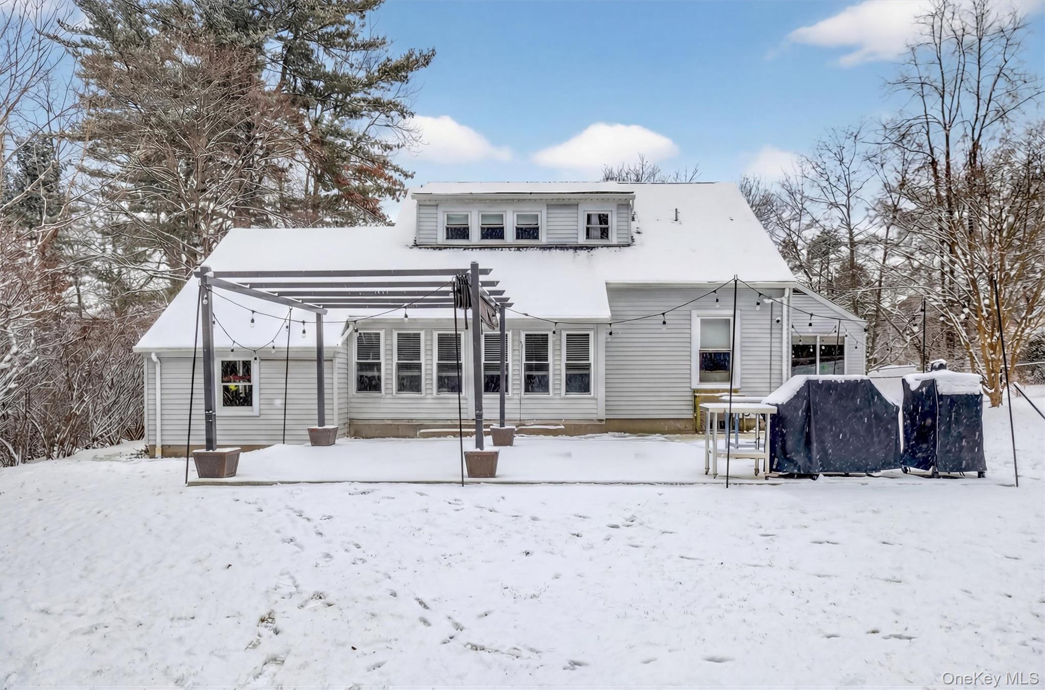 36 Vassar View Road Poughkeepsie, NY 12603 - Photo 25 of 31 a front view of a house with a yard covered in snow