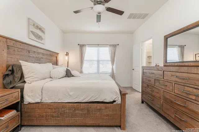 a bed room with a bed and a flat screen tv