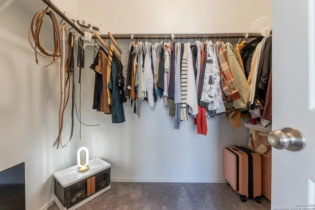 a view of a chairs and table in the patio along the house