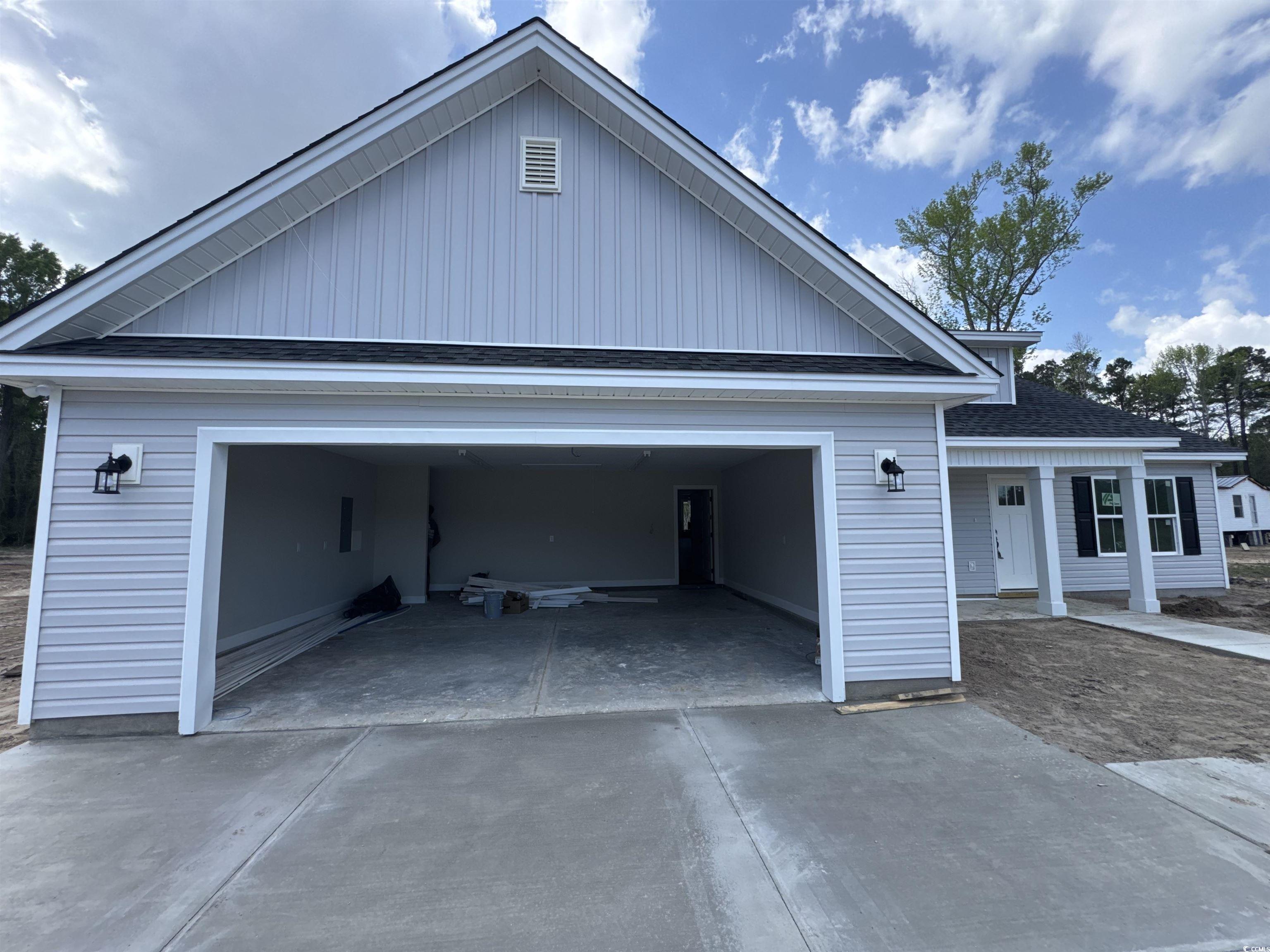 4020 Copperhead Road Conway, SC 29527 - Photo 4 of 16 Garage featuring concrete driveway