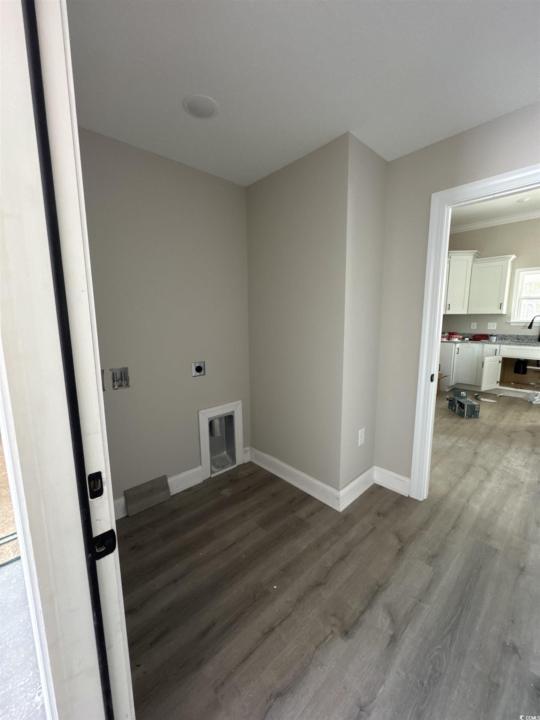 4020 Copperhead Road Conway, SC 29527 - Photo 7 of 16 Laundry area with baseboards, wood finished floors