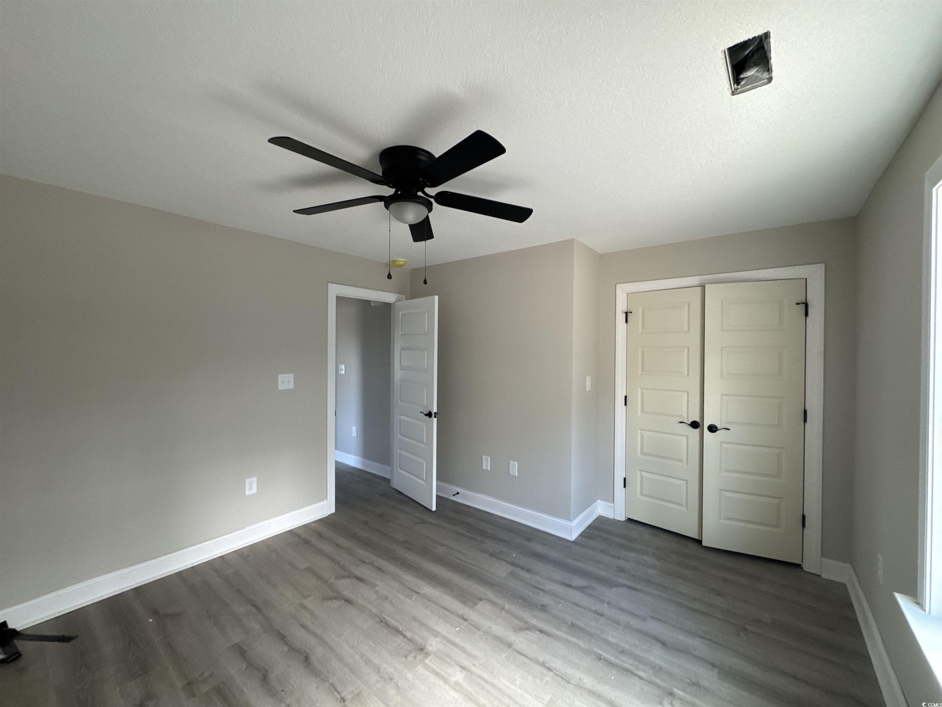 4020 Copperhead Road Conway, SC 29527 - Photo 8 of 16 Unfurnished bedroom featuring baseboards, a closet