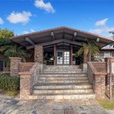 a view of a chair and tables in patio