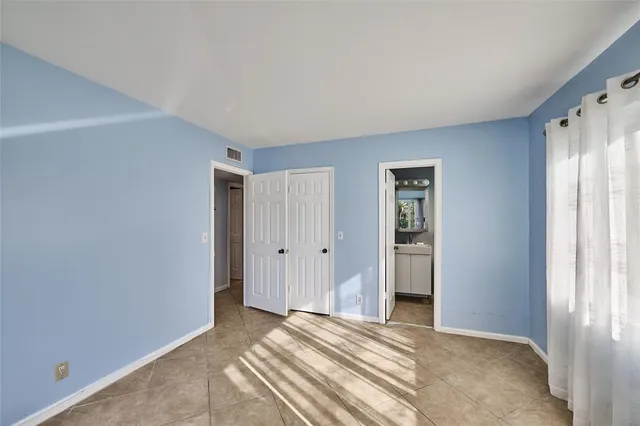 a room with window and furniture