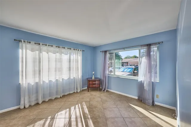 a view of a house with yard and sitting area
