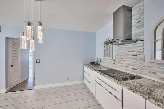 a kitchen with a sink and a stove