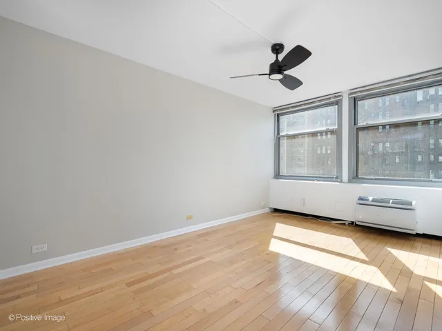 a view of livingroom with furniture wooden floor and window