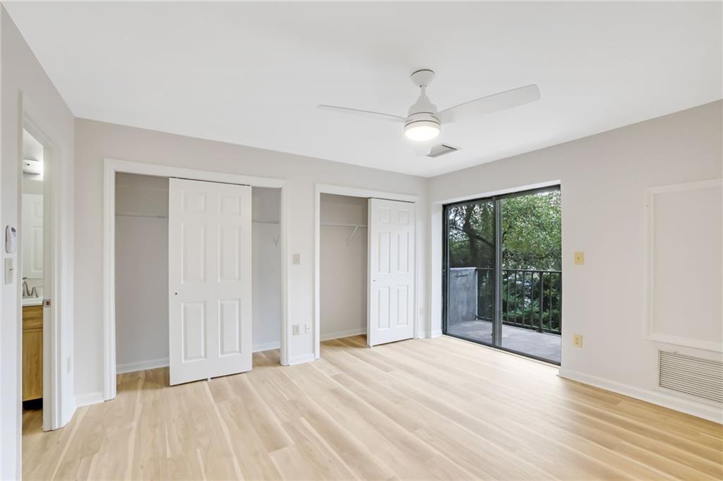 300 Johnson Ferry Road, Unit B103 Atlanta, GA 30328 - Photo 17 of 40 a view of empty room with wooden floor and fan