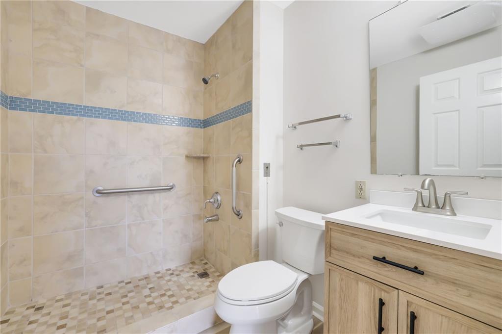 300 Johnson Ferry Road, Unit B103 Atlanta, GA 30328 - Photo 20 of 40 a bathroom with a sink a toilet and shower