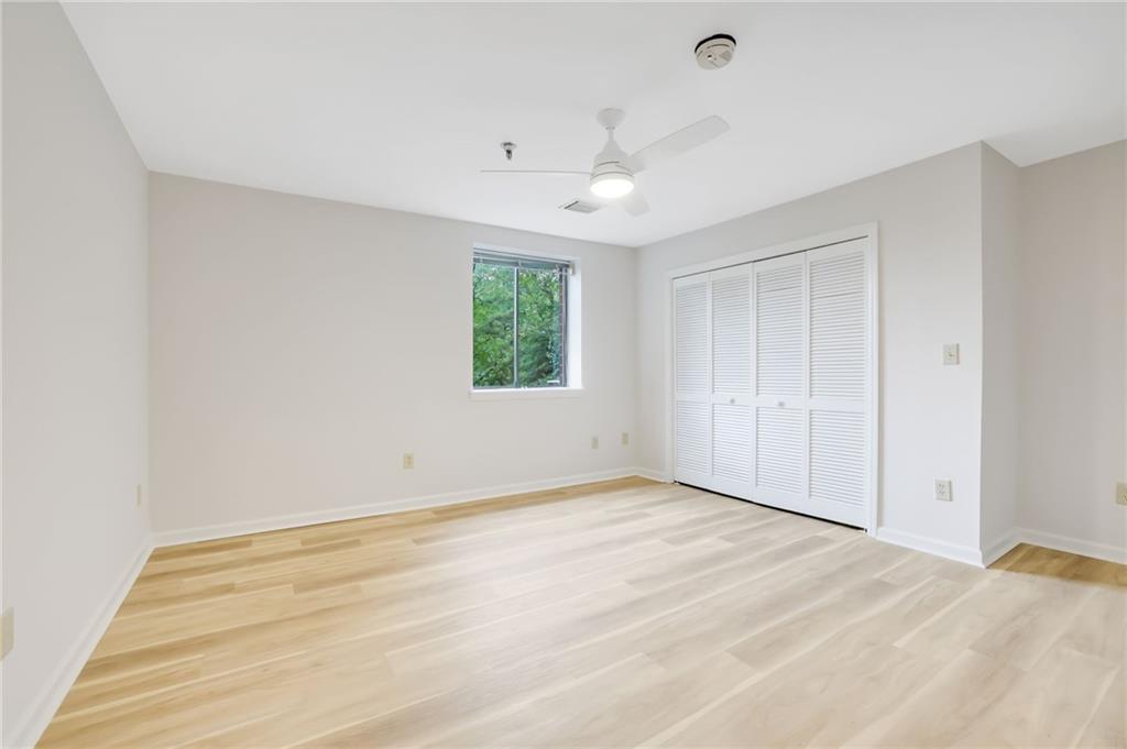 300 Johnson Ferry Road, Unit B103 Atlanta, GA 30328 - Photo 21 of 40 a view of an empty room with a window