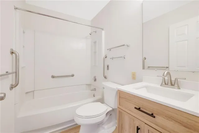 a bathroom with a sink a toilet and a bathtub