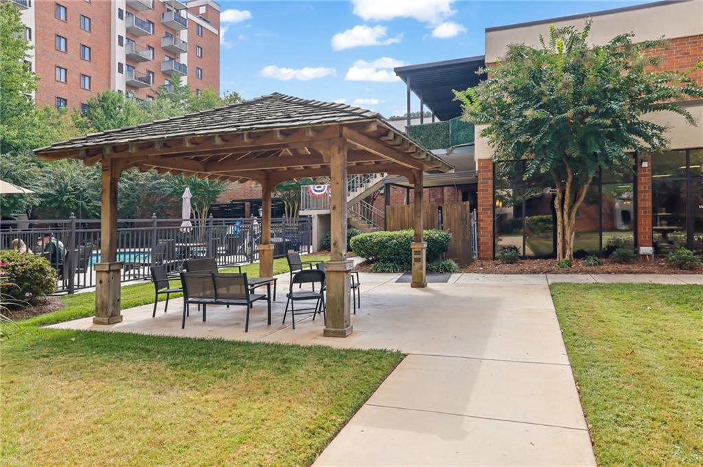 300 Johnson Ferry Road, Unit B103 Atlanta, GA 30328 - Photo 27 of 40 a view of a swimming pool with a patio