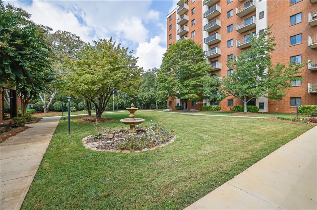 300 Johnson Ferry Road, Unit B103 Atlanta, GA 30328 - Photo 28 of 40 a garden view with a fountain