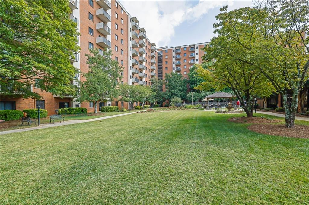 300 Johnson Ferry Road, Unit B103 Atlanta, GA 30328 - Photo 29 of 40 a view of a building with a yard