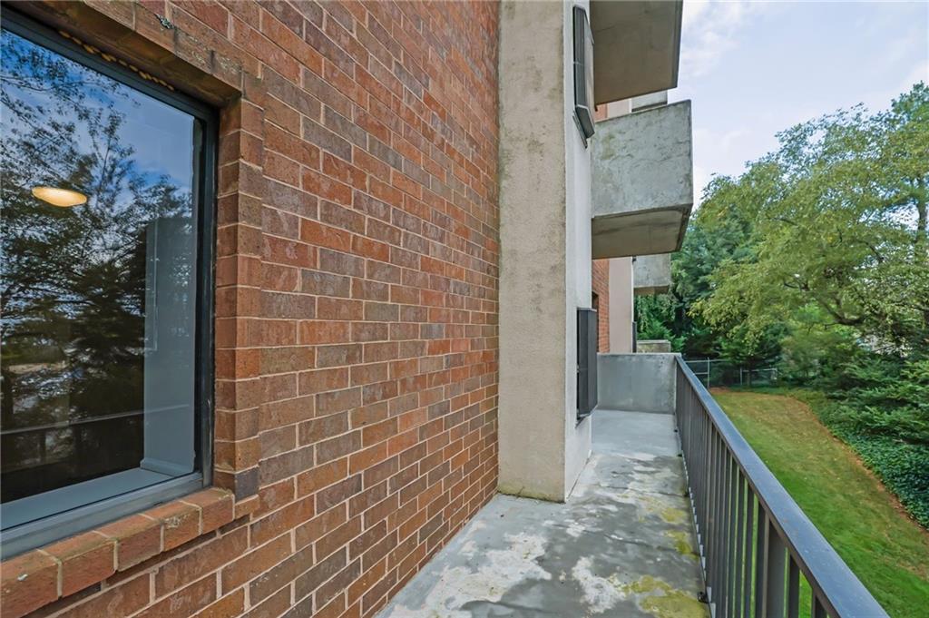 300 Johnson Ferry Road, Unit B103 Atlanta, GA 30328 - Photo 39 of 40 a view of a pathway both side of house
