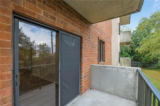 a view of a door and a window
