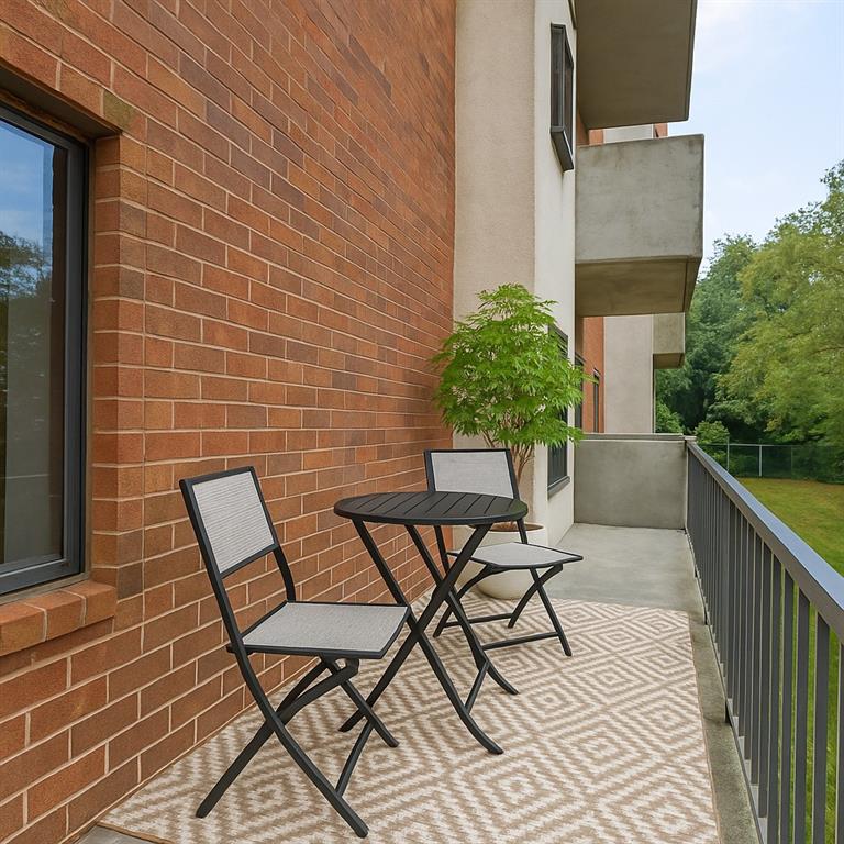 300 Johnson Ferry Road, Unit B103 Atlanta, GA 30328 - Photo 4 of 40 a view of a chairs and table on the terrace