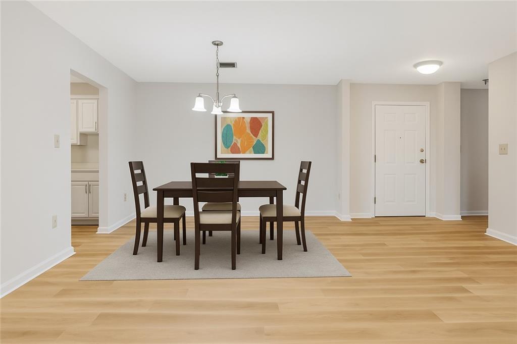 300 Johnson Ferry Road, Unit B103 Atlanta, GA 30328 - Photo 5 of 40 a view of a dining room with furniture
