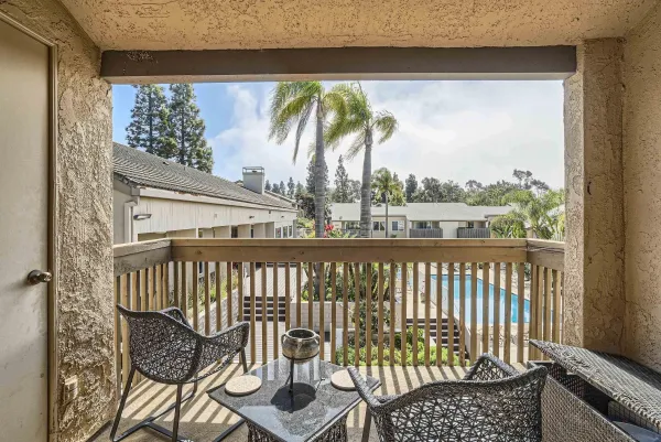 a view of a patio with swimming pool