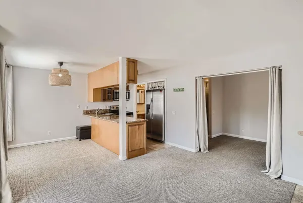 a kitchen with stainless steel appliances kitchen island a refrigerator sink and stove