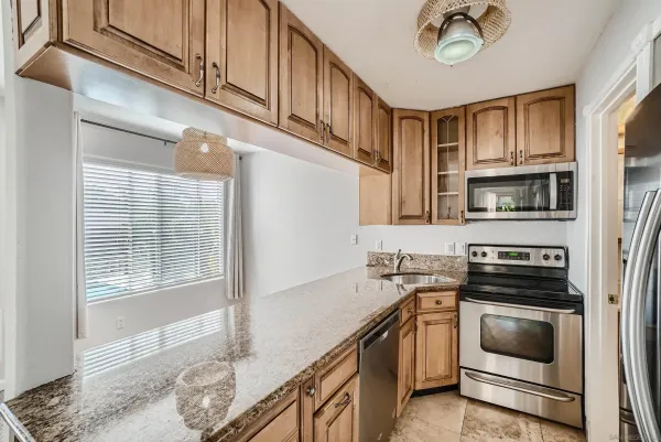 a kitchen with a stove and a microwave