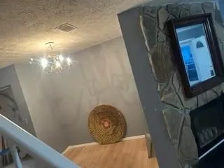 a bedroom with a bed and a fireplace