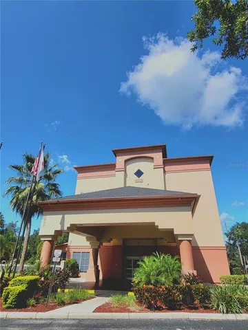 front view of house with potted plants