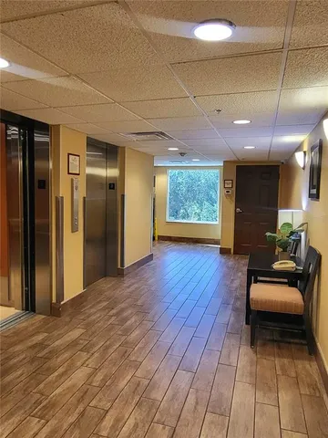 a view of a livingroom with furniture and wooden floor