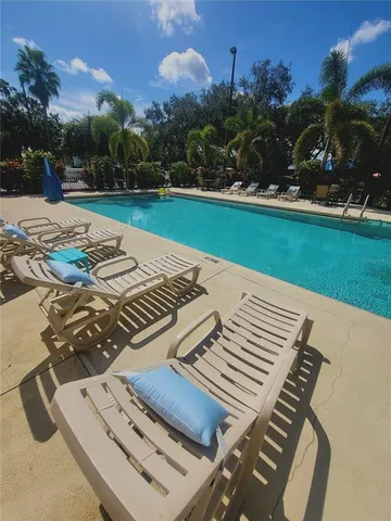 a view of a backyard with sitting area