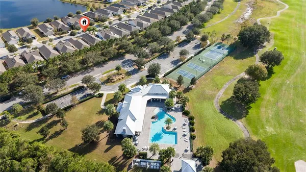 an aerial view of residential houses with outdoor space