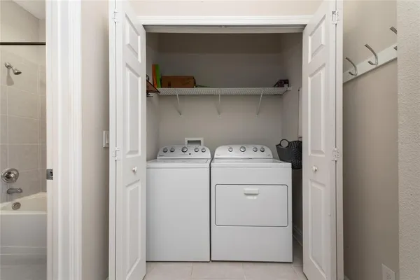 a utility room with dryer and washer