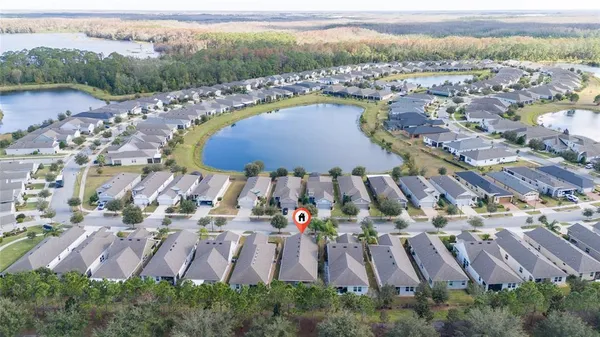 an aerial view of residential house with outdoor space