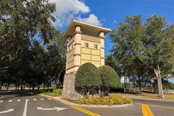 a front view of a building with tree s
